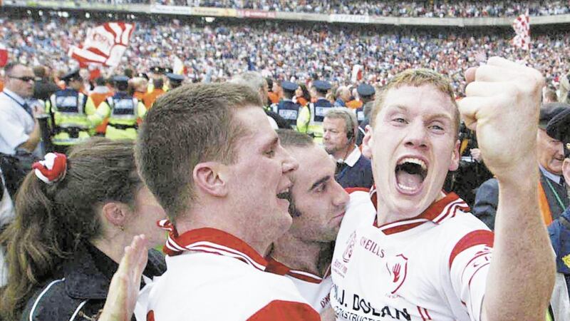 Celebrating Tyrone's 2003 All-Ireland victory with the late Cormac McAnallen. An unswerving commitment to the cause, with 'balance' nowhere to be seen, was the catalyst for fulfilling that dream