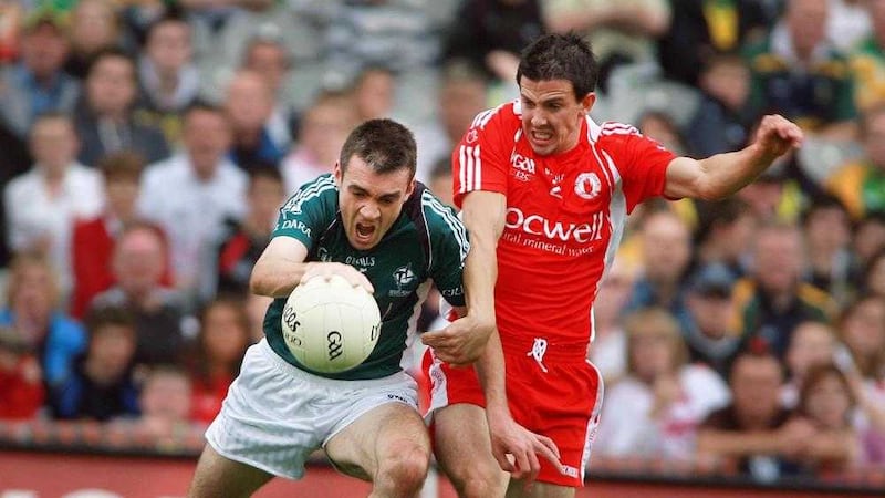 Tyrone&#39;s PJ Quinn (right), pictured in action against Kildare&#39;s Johnny Doyle, has had to retire from the inter-county scene due to injury. Picture by Seamus Loughran 