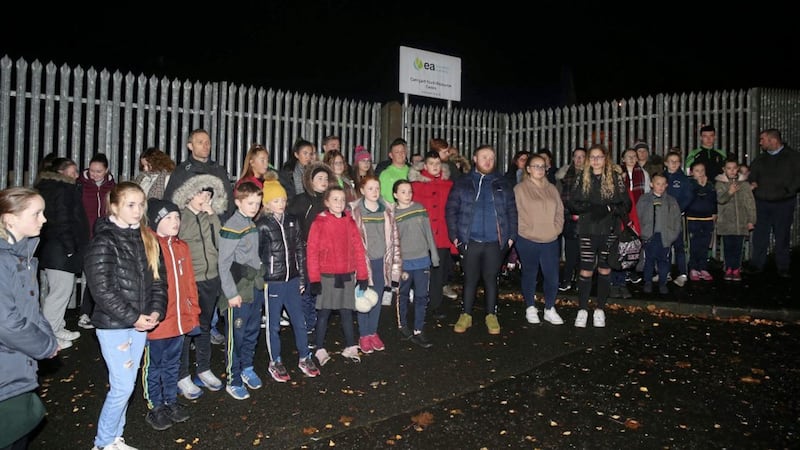 Young people who use the Irish Medium Youth Club in Lenadoon protested outside its gates last night after a flood forced its closure. Picture Mal McCann 