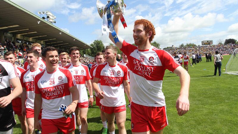 Conor Glass celebrates Derry's Ulster MFC victory last year along with his team-mates &nbsp;