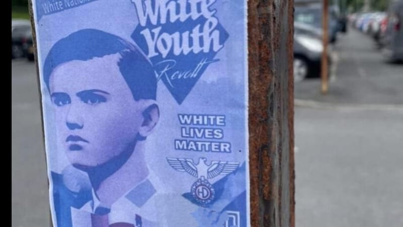 A Nazi-style recruitment poster was spotted outside Downpatrick bus station.