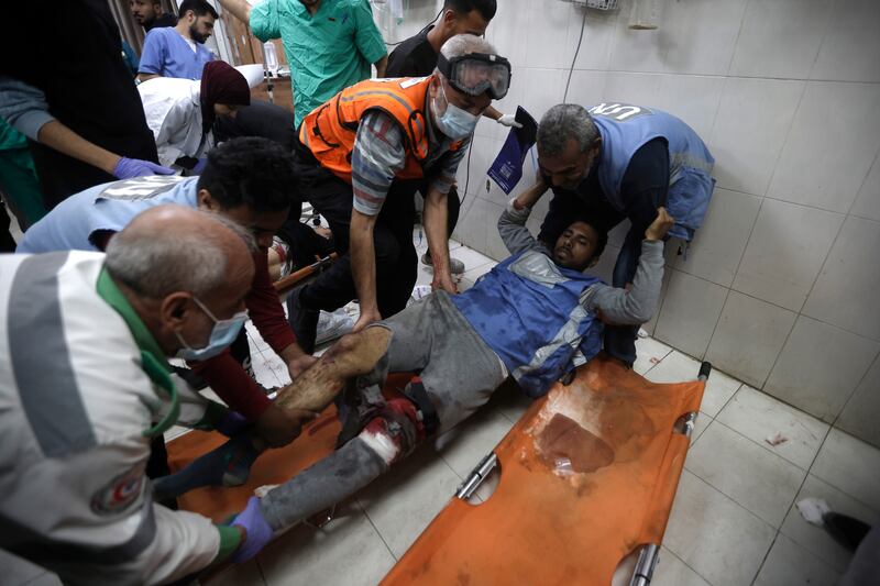 A United Nations worker wounded in Israeli airstrikes on a UN-run school arrives at the Nasser hospital in the town of Khan Younis, southern Gaza Strip, on Sunday (Mohammed Dahman/AP)