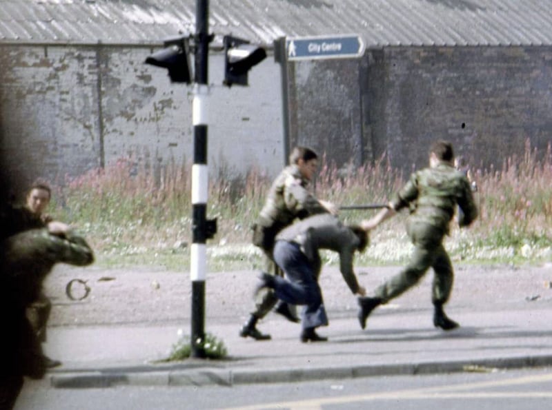 A man is arrested by the British Army following riots near Belfast City Centre 