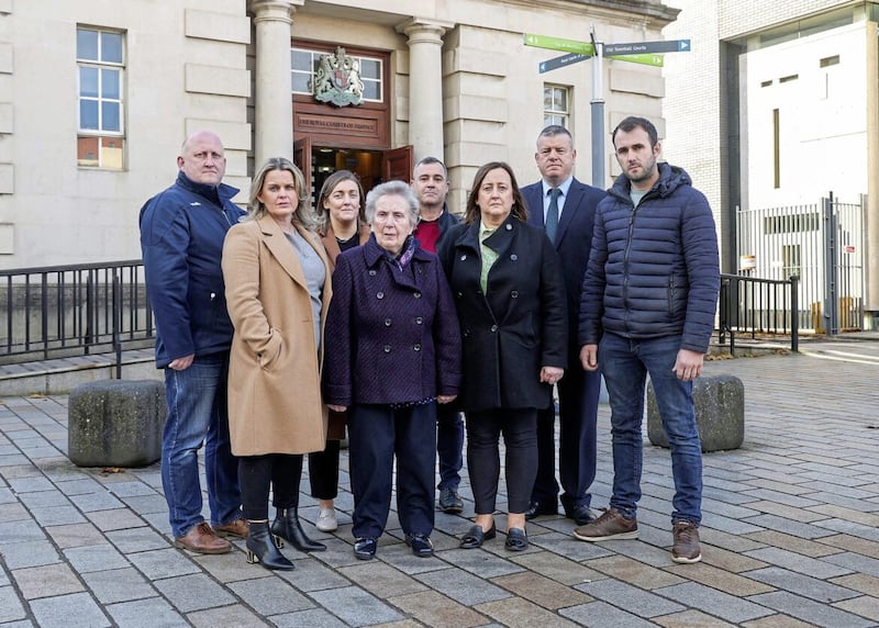 Bridie Brown, the widow of murdered GAA official Sean Brown, with family members and their legal team outside Belfast's High Court. PICTURE: MAL MCCANN