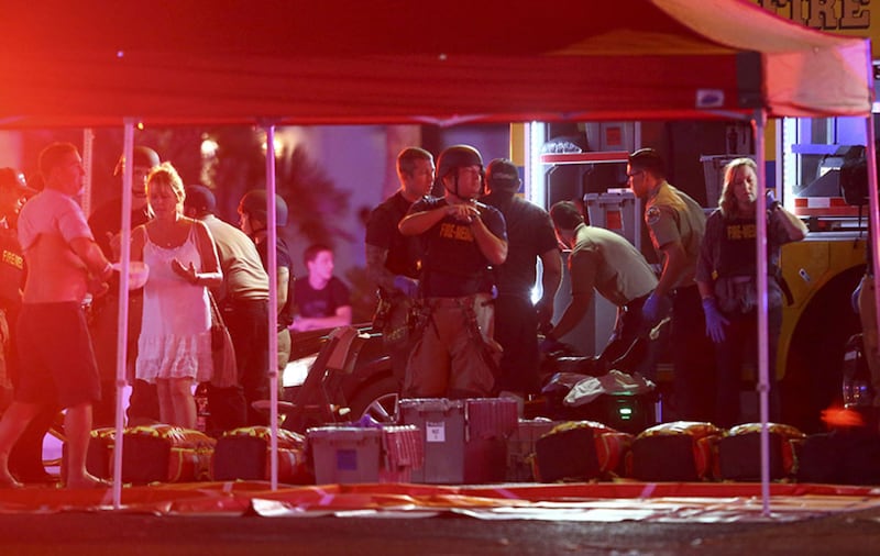 Medics treat the wounded as Las Vegas police respond during an active shooter situation on the Las Vegas Strip&nbsp;