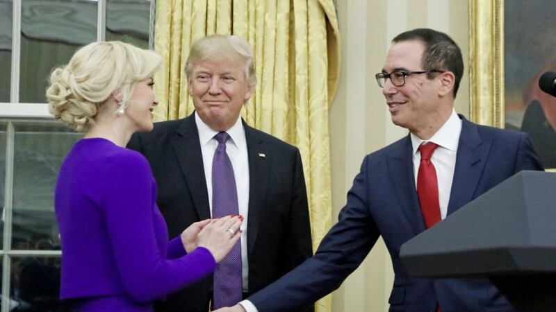 US president Donald Trump with Treasury Secretary Steven Mnuchin and his fiance Scottish actress Louise Linton after he was sworn-in. Picture by Manuel Balce Ceneta, Associated Press 
