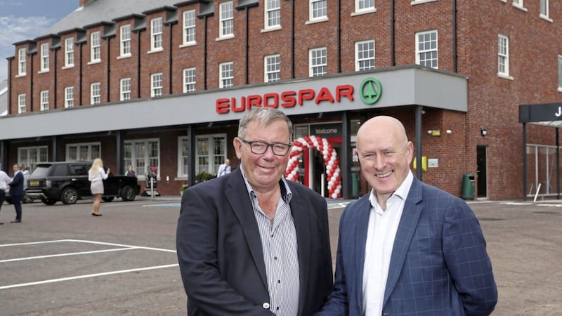Bill Porter from Porter &amp; Co (left) with Mark McCammond, retail director at Henderson Group, following the opening of the 8,000sq ft EuroSpar at Wallace Village in Lisburn 