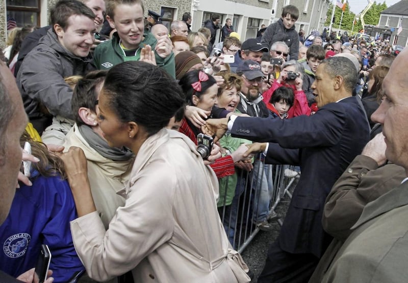US President Barack Obama and first lady Michelle Obama greet local residents at Ollie Hayes pub in Moneygall Ireland the ancestral homeland of his great-great-great grandfather. Picture by Charles Dharapak, Associated Press