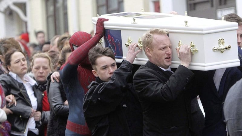 Kayden Fleck&#39;s father Darrel and superhero Spiderman carry his coffin at the funeral in Ballymena yesterday. Picture by Aidan O&#39;Reilly/Pacemaker 
