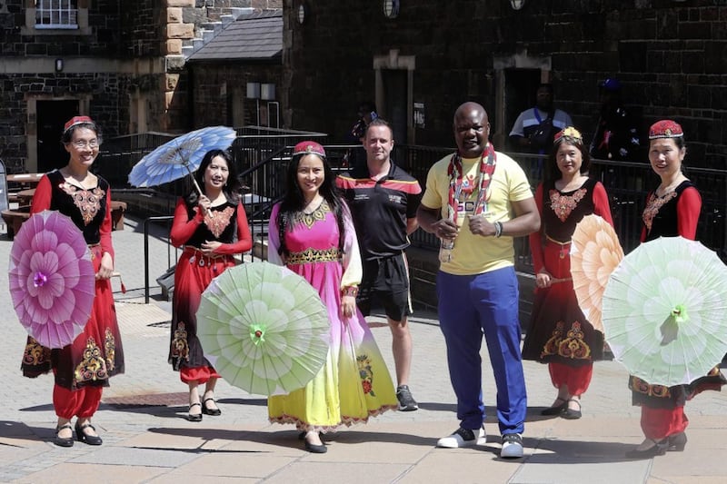 Jahswill with Chinese tambourine dancers 