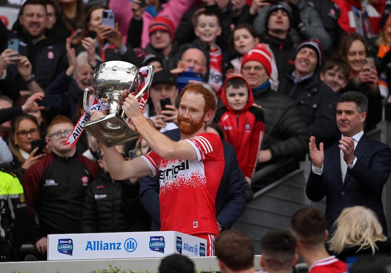 Derry’s Conor Glass collects the Allianz GAA Football League Division One trophy after beating Dublin in Sunday's final at Croke Park. Picture: Mark Marlow