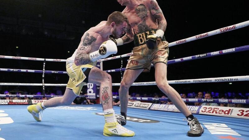 Tyrone McKenna and Anthony Upton do battle during Saturday night&#39;s super-lightweight showdown at the SSE Arena. Picture by PA 