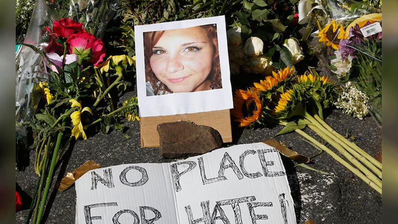 A makeshift memorial of flowers and a photo of victim, Heather Heyer in Charlottesville. Picture by&nbsp;Steve Helber, AP Photo