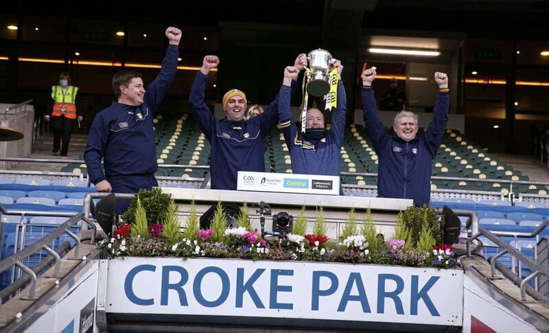 Antrim's management team of Darren Gleeson, Johnny Campbell, Gary O'Kane and Jim Close celebrate with the Joe McDonagh Cup after their Saffrons' side defeated Kerry in the final. Picture by Seamus Loughran.