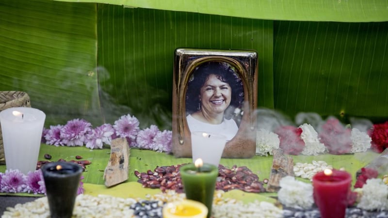 A framed image of environmentalist Berta Caceres on a makeshift altar made in her honor during a demonstration outside the Honduran embassy, in Mexico City Pictures: Eduardo Verdugo/AP 