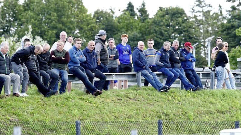 Fans had to watch the Armagh Division 1A between Maghery and Crossmaglen Rangers at Maghery from outside the ground in July. Pic Philip Walsh.. 