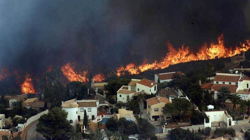 A wildfire burns nearby Benitachel village, near Valencia, PICTURE: Alberto Saiz/AP 