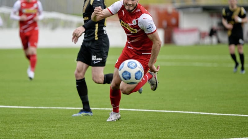 Cliftonville&#39;s Luke Turner chases the ball during the Dankse Bank Premiership game with Larne at Solitude Picture: Andrew McCarroll/ Pacemaker Press. 
