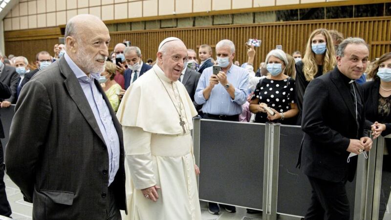 Pope Francis walks with Carlo Petrini at the Vatican on Saturday. He has formed an unusual partnership with the agnostic former communist founder of the Slow Food movement to double-down on his calls to protect the environment from profit-driven development that Francis says is harming the poorest most. The Pope welcomed Mr Petrini to the Vatican and met with participants of a committee he formed to help put into practice Francis&#39;s appeals for environmental sustainability and solidarity articulated in his 2015 encyclical Laudato Si&#39;. Picture by Vatican Media via AP 