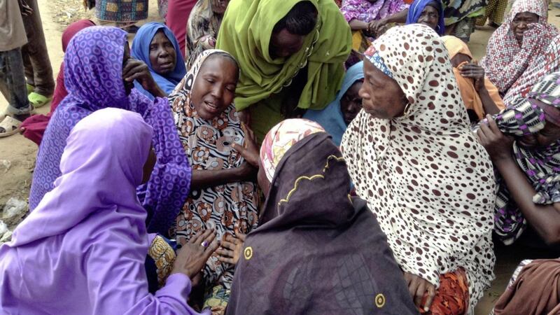 Women mourns the death of a family member after a suicide attack at a camp for people displaced by Islamist extremist in Maiduguri, Nigeria, Picture: Makama Sule/AP 