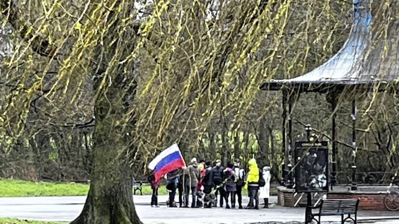 Social media users spotted the crowd carrying a Russian flag in Ormeau Park. Picture from Twitter 