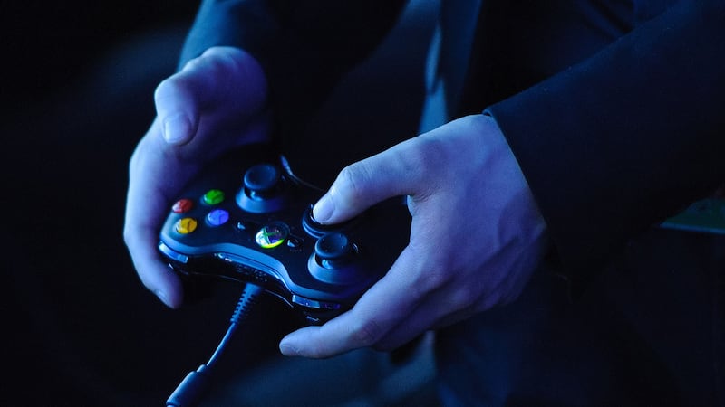 A man holds an Xbox 360 controller at a preview event for Star Trek: the Video Game, at the Science Museum, in central Lodnon.