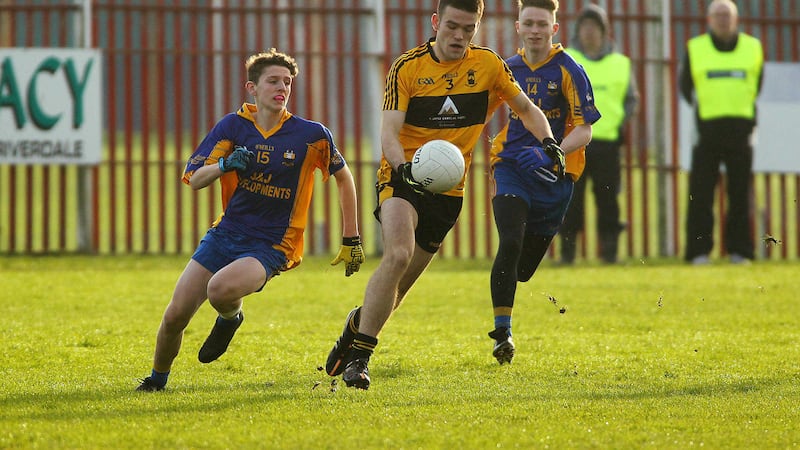 St Eunan's Darragh McWalters gets away from Enniskillen Gaels' Timmy Boyd during Sunday's Ulster minor semi-final at St Paul's <br />Picture by Seamus Loughran&nbsp;