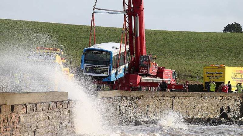 The bus is lifted off the shores of Strangford Lough where it had become partially submerged