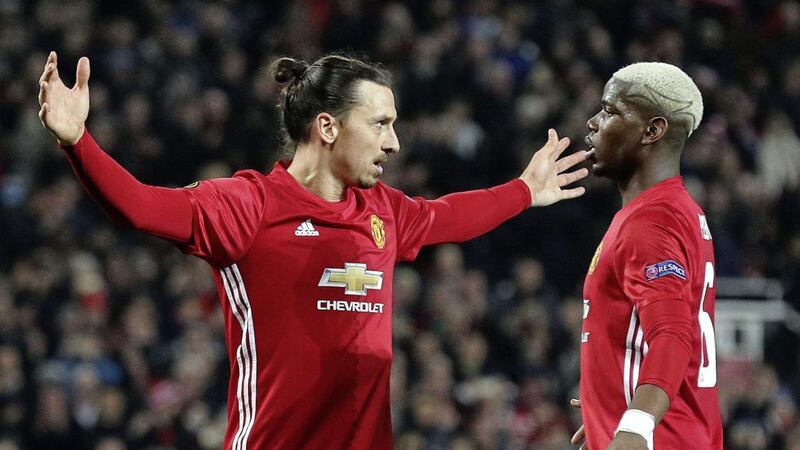 Ibrahimovic celebrates his hat-trick in the win over St Etienne with Paul Pogba 