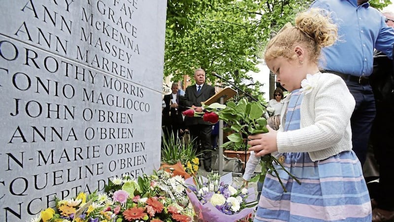 Haley O&#39;Brien (4) whose great uncle John O&#39;Brien was killed in the Dublin-Monaghan bombings, lays a wreath in Talbot Street Dublin, during a ceremony to mark the 42nd anniversary of the bombings last year. Picture by Niall Carson/PA Wire. 