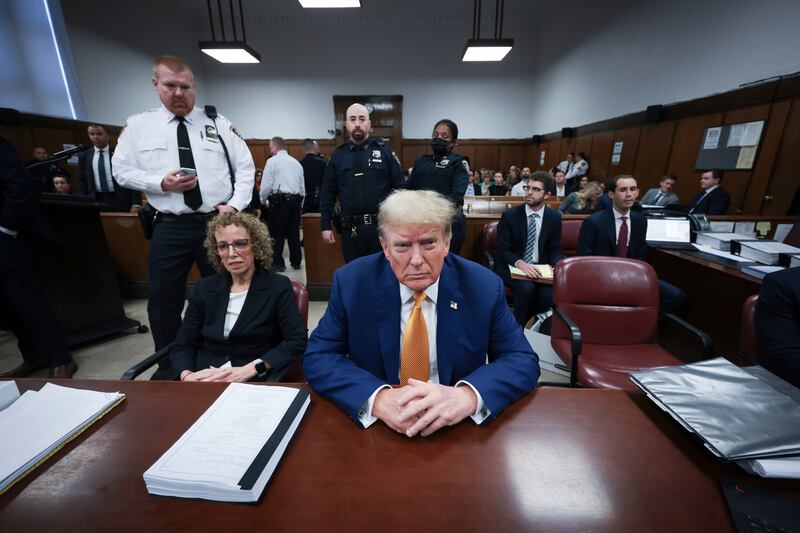 Former President Donald Trump either looked straight ahead or at the desk as Stormy Daniels gave evidence, and was seen occasionally whispering with his lawyers (Win McNamee/Pool Photo via AP)