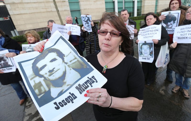 Janet Donnelly holds a photograph of her father Joseph Murphy. Picture by Hugh Russell&nbsp;