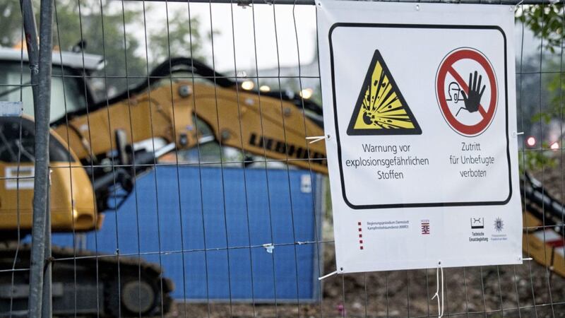 A warning poster seen at the place where a Second World War bomb was found in Frankfurt, Germany, on Sunday. Picture by Andreas Arnold, dpa via Associated Press 