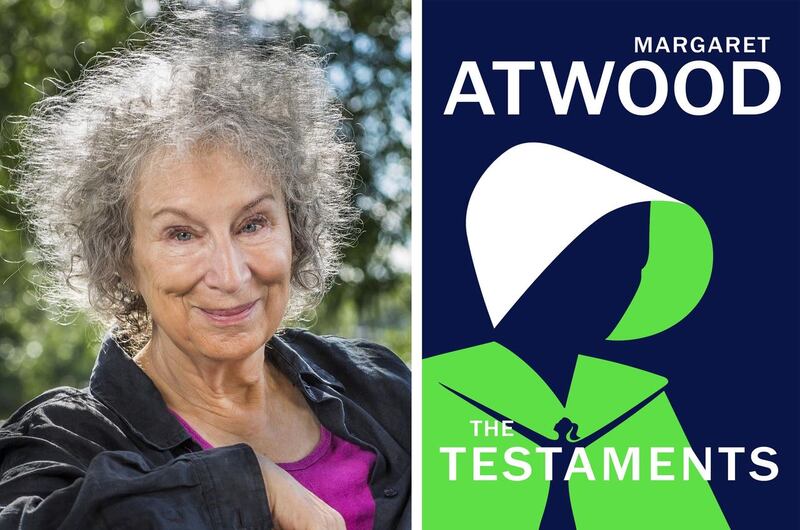 Margaret Atwood with the front cover of The Testaments