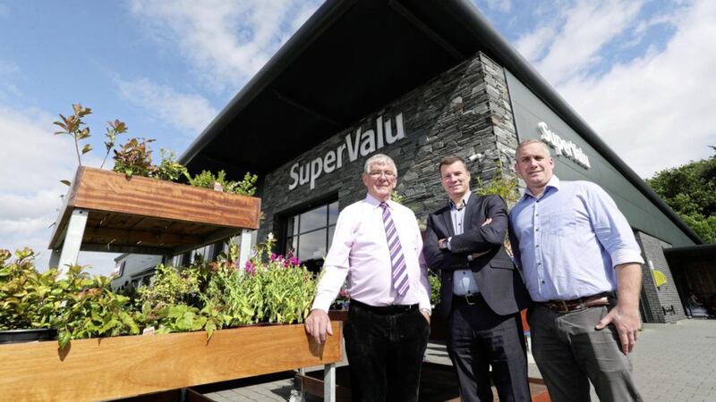 Pictured outside the newly rebranded SuperValu Fruitfield in Richhill are: SuperValu retailer, Neville Woods; Nigel Maxwell, SuperValu sales director; and SuperValu retailer, Phillip Woods. 