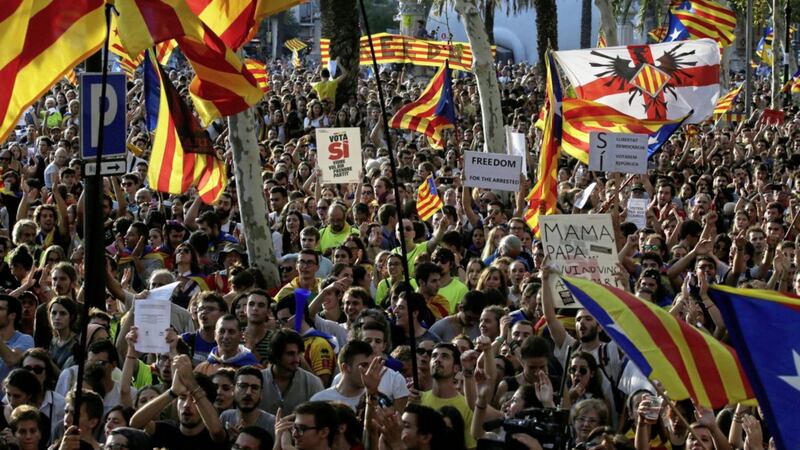 People shout slogans during a protest in Barcelona on Thursday. Picture by Manu Fernandez, Associated Press 
