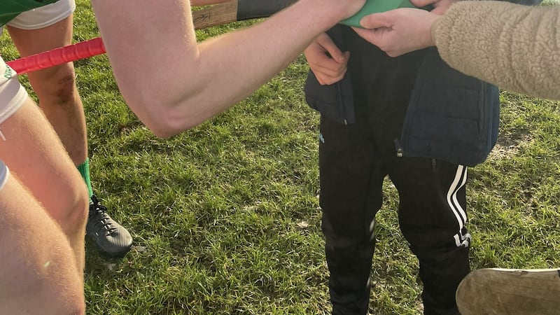 A young Fermanagh fan gets an autograph from an Erne County hurler earlier this year.