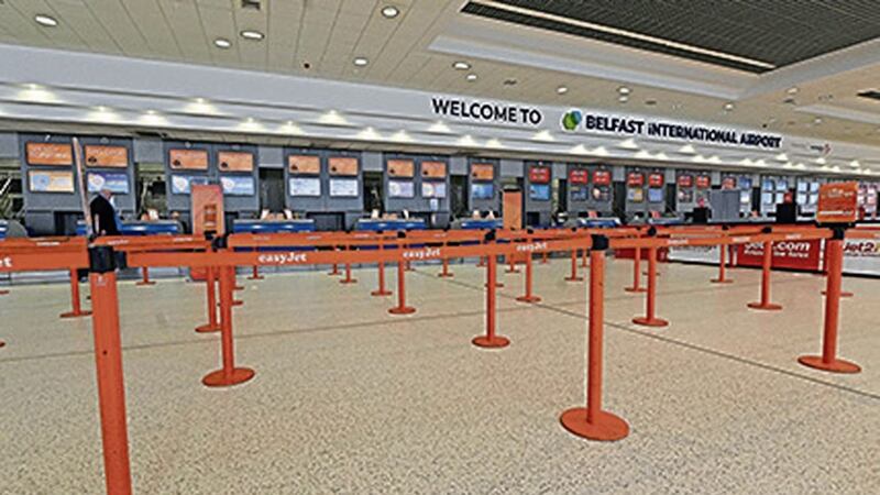 Check-in at Belfast International Airport is quiet right now as all passenger flights have been cancelled. Photo: Colm Lenaghan/Pacemaker 