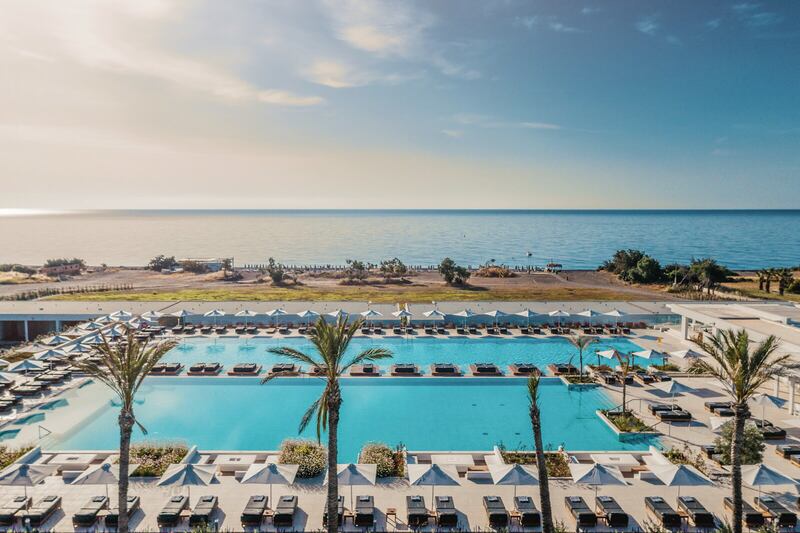The pool at the Gennadi Grand Resort, with the beach and sea beyond