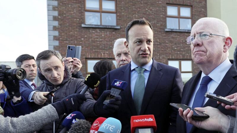 Leo Varadkar, second right, and Minister for Justice Charlie Flanagan, far right, speaking to media in Drogheda on Friday. Picture by Brian Lawless/PA 