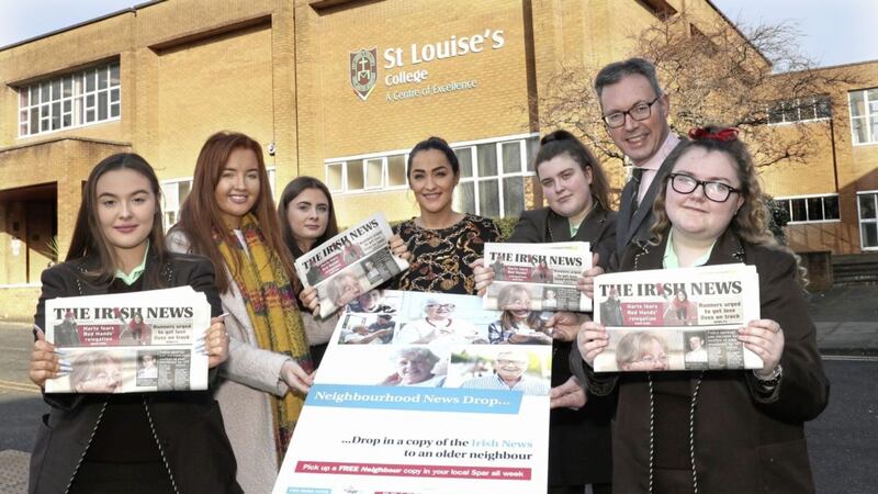 Pupils from St Louise&rsquo;s Comprehensive College in west Belfast, who are taking part in the Pope John Paul II Award, show their support for the Irish News Neighbourhood News Drop initiative. Pictured, from left to right, are: Amy Martin, Catherine Maguire of The Irish News, Jayne Magill, Alanah McGlinchey, St Louise&rsquo;s teacher Meabh McGroarty, Irish News marketing manager John Brolly, and Bridgeen Downey. Picture by Declan Roughan 