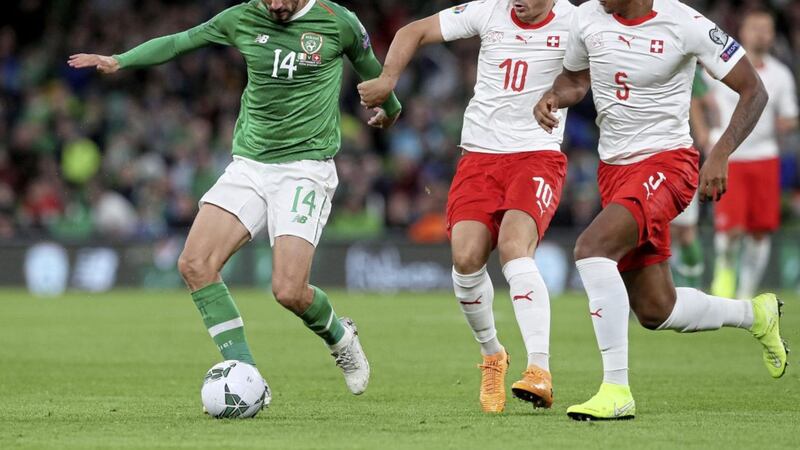 Republic of Ireland&#39;s Conor Hourihane (left) battles for the ball with Switzerland&#39;s Granit Xhaka (left) and Manuel Akanji (right) last month. Another tough test awaits in Geneva tonight 