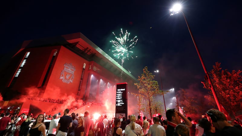 Liverpool fans celebrate outside Anfield after the team were crowned Premier League champions when Manchester City lost 2-1 to Chelsea at Stamford Bridge. Picture by Peter Byrne/PA Wire&nbsp;