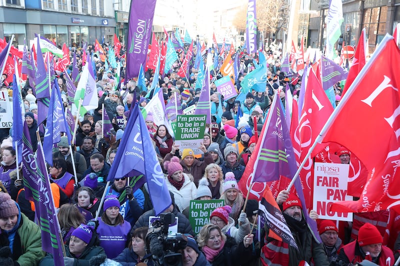 Public sector workers who are on strike gather at the Belfast City Hall for a rally. PICTURE MAL MCCANN