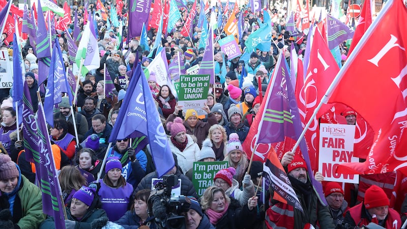 Public sector workers who are on strike gather at the Belfast City Hall for a rally. PICTURE MAL MCCANN