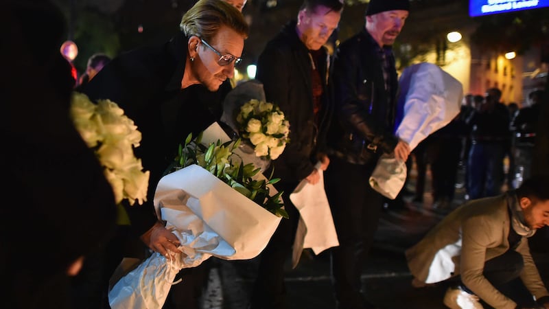 U2 cancelled their Paris gig and laid flowers in tribute to the victims of the terrorist attacks &nbsp;