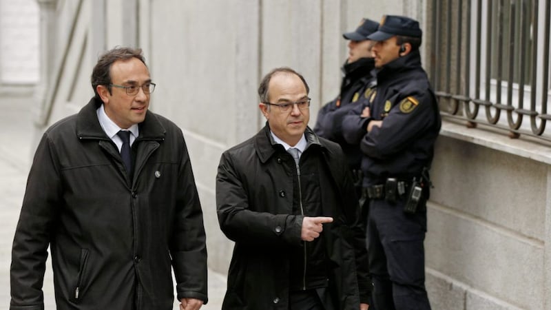 Catalan president candidate Jordi Turull, centre and former cabinet member Josep Rull arrive at the Supreme Court in Madrid, Friday PICTURE: Francisco Seco/AP 