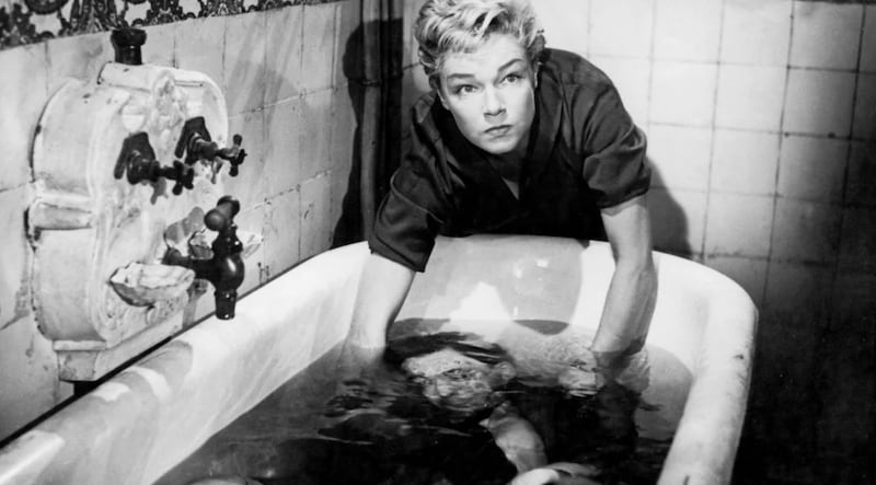 A black and white still of the bathtub murder scene from Les Diaboliques