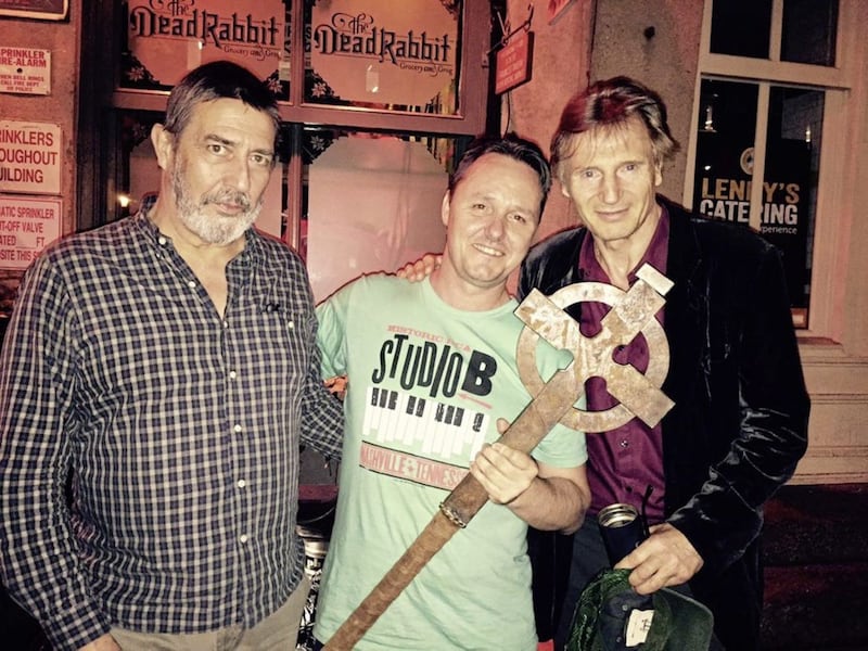 Sean Muldoon, centre, with actors Ciar&aacute;n Hinds and Liam Neeson in The Dead Rabbit bar
