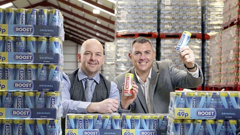 TOP OF THE POPS: Boost Energy founder and managing director Simon Gray (right) with Gareth Hardy, managing director of County Antrim-based Hardy Sales and Marketing Ltd when they signed an exclusive five-year distribution deal with the drinks company five years ago 